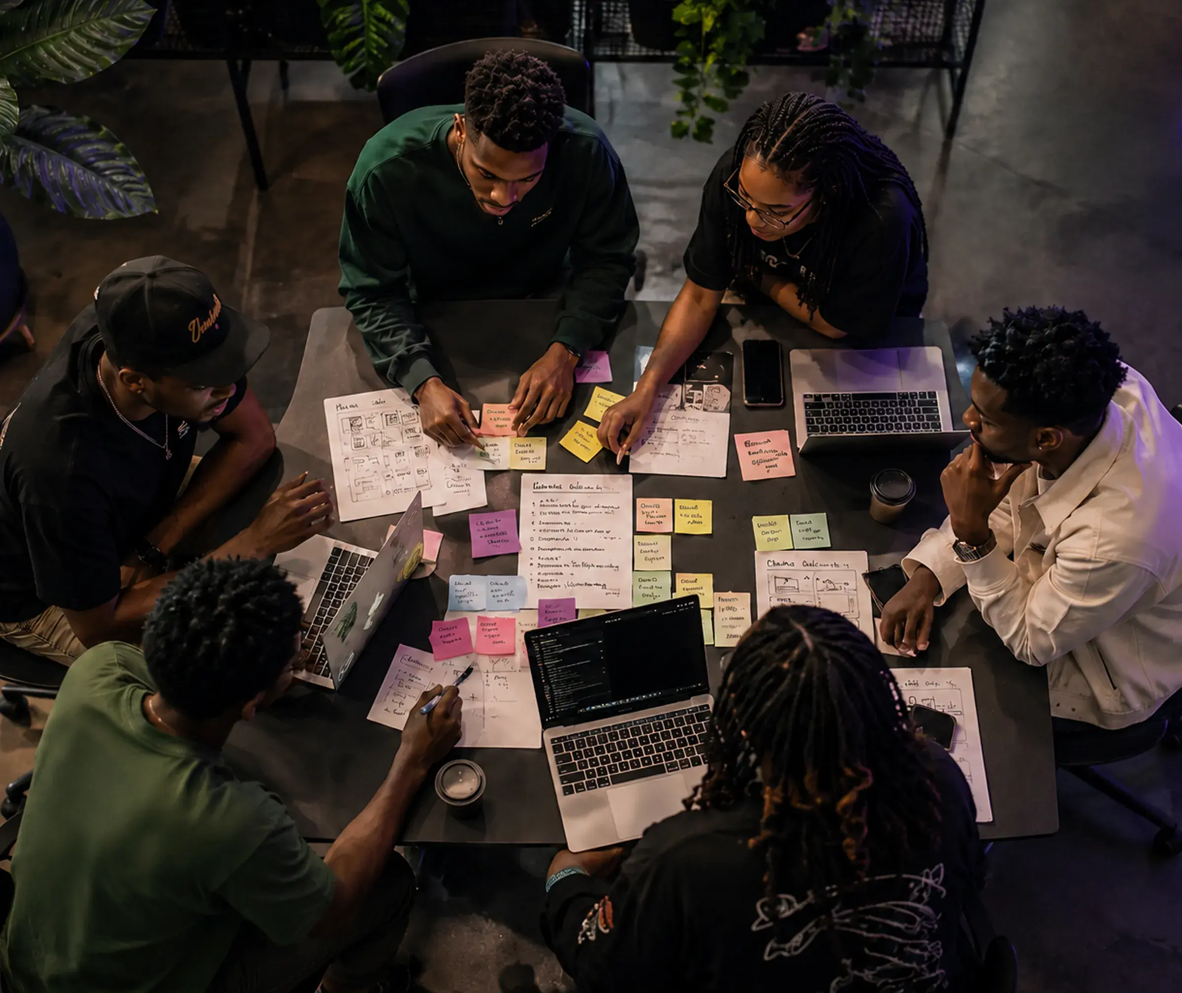 Hackathon team collaborating around table